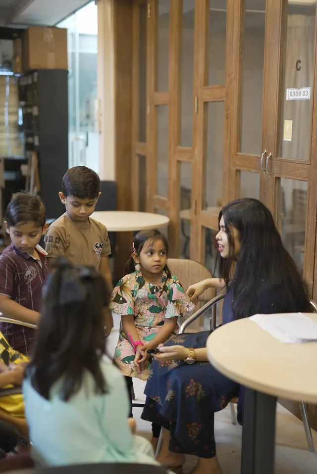 A trainer working one to one with a junior student